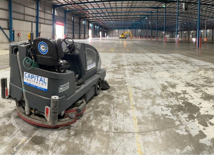 Ride-On Industrial Scrubber Image of CS7010 Sweeper Scrubber at Construction Site