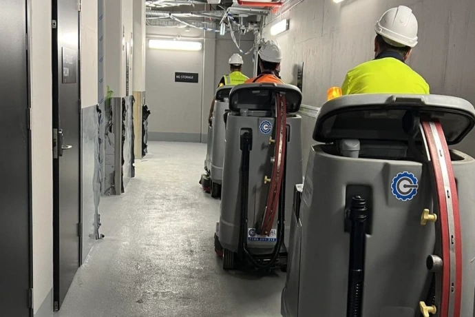 Airside facility cleaning equipment Cleaning equipment and operators maintaining airside service corridors in an aviation facility